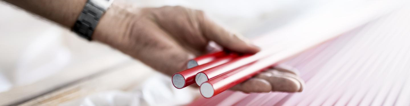 a person holding a red phone