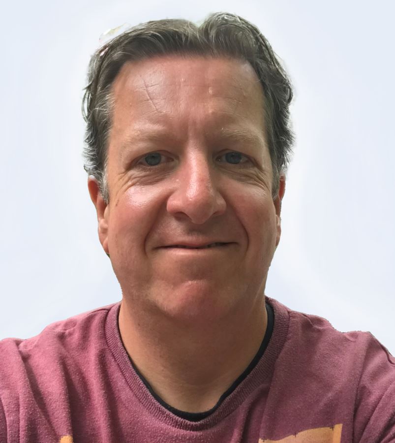 a man in a pink shirt