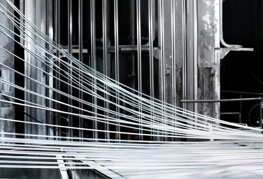 Lengths of aluminum emerging from a paint line