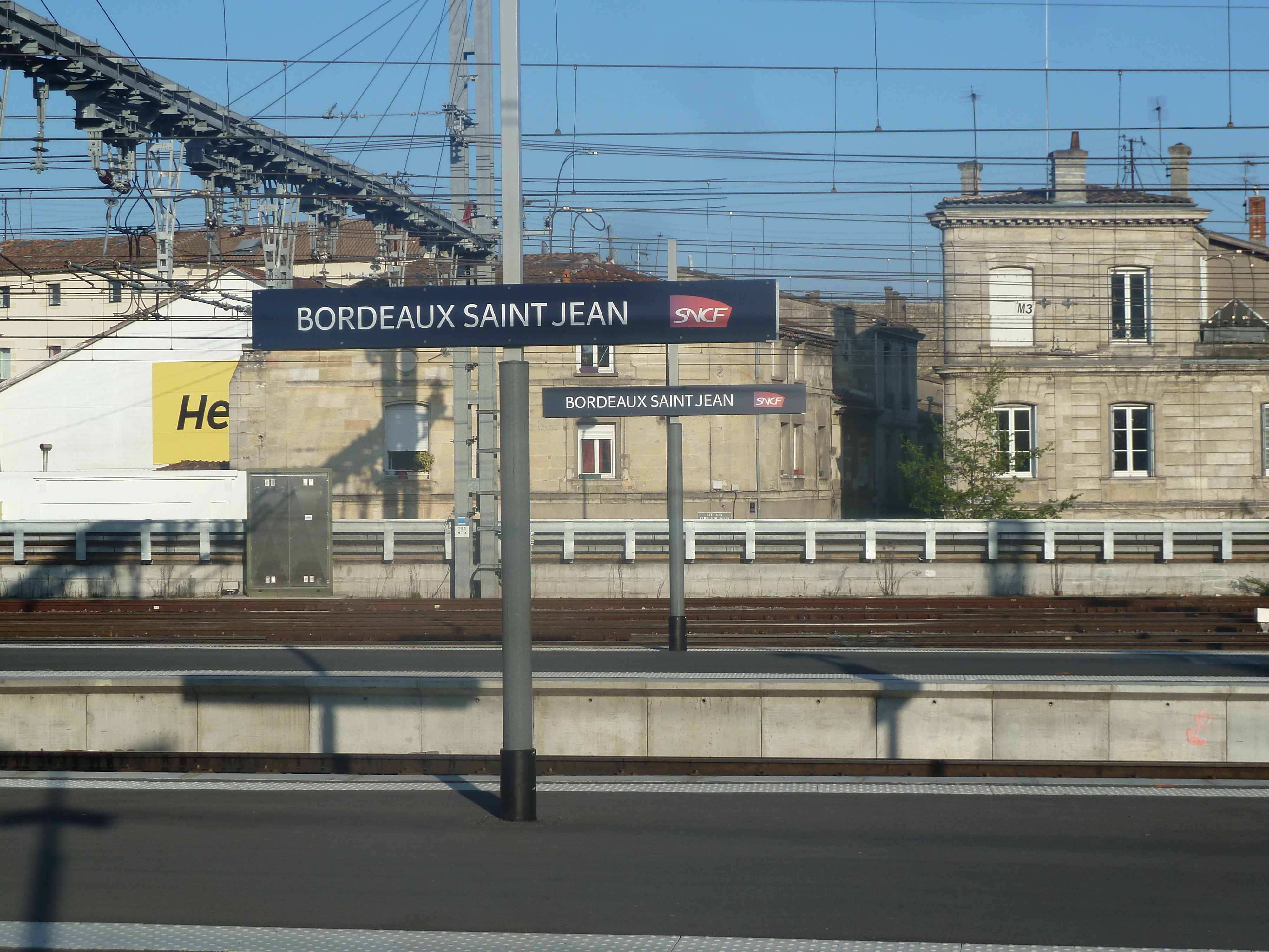 railway station. poles holding cables and lights