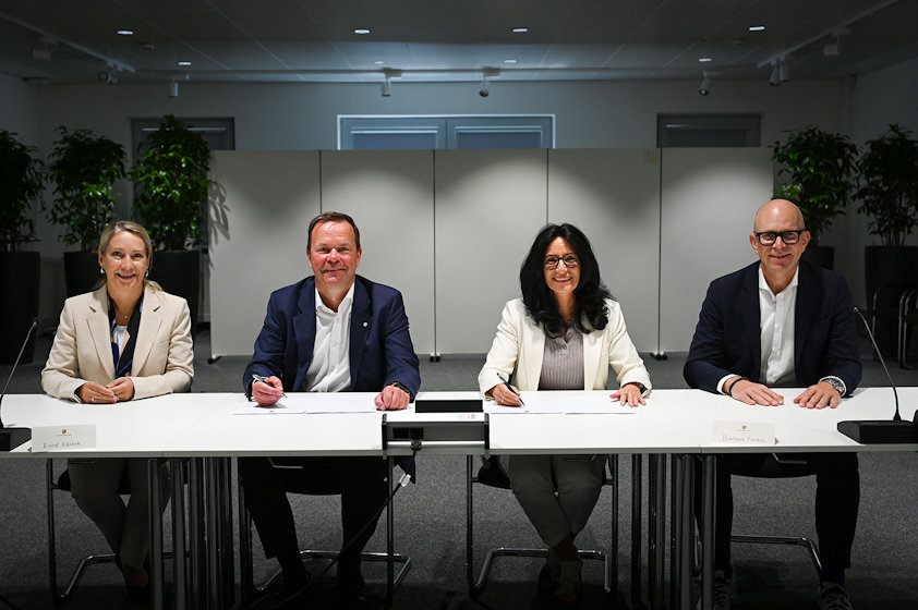 a group of people sitting at a table