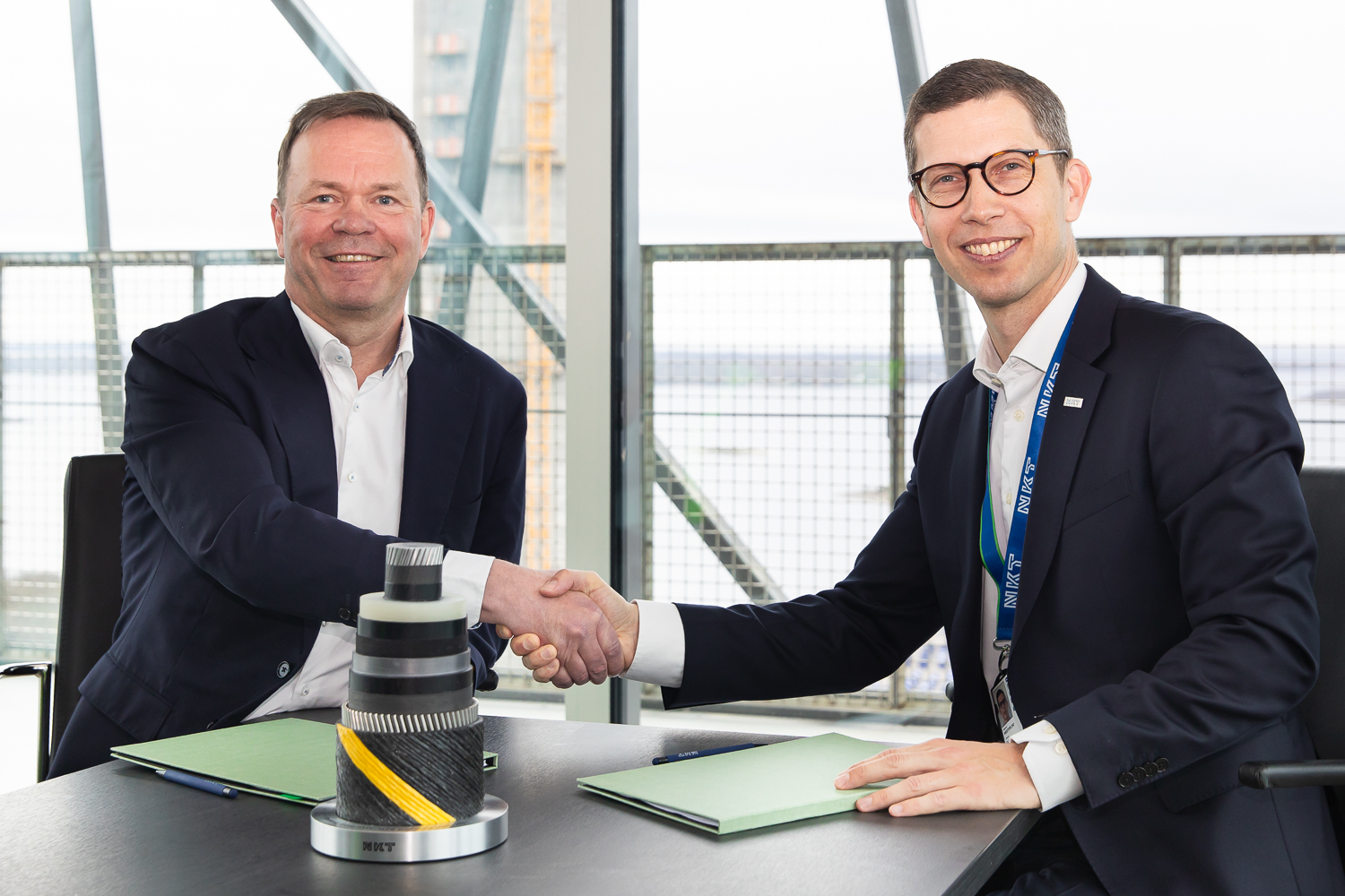 a couple of men shaking hands