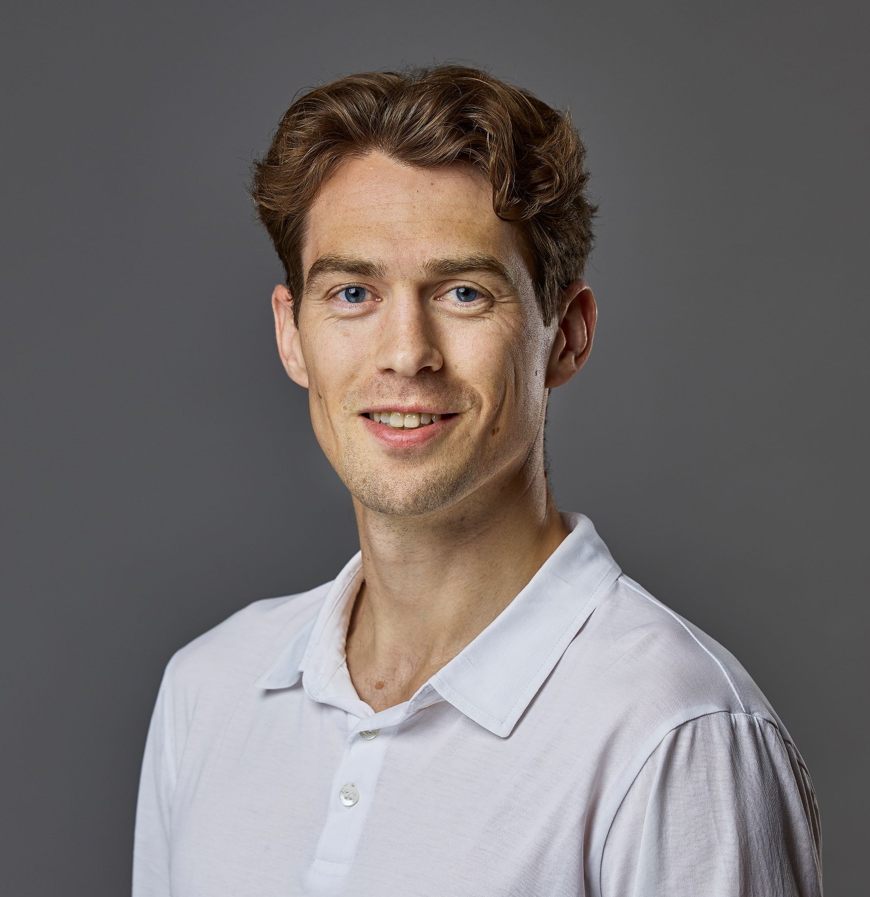 a man smiling for the camera