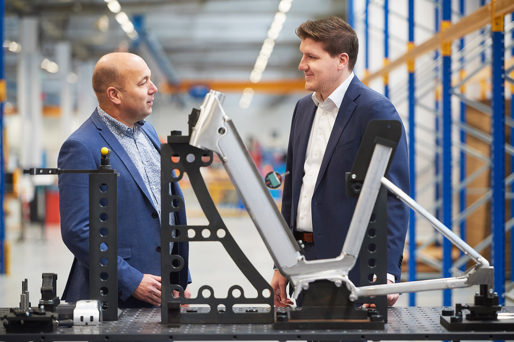 men in suits looking at a computer